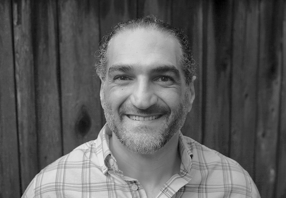 Black and white headshot of author Othman Hamdan, The Imprisioned Blogger.